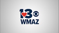 the logo for wmaz on a gray background
